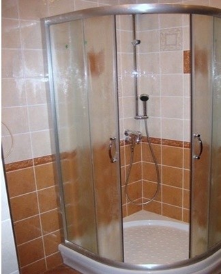 Glass or plastic panels are attached to the frame on both sides with fasteners.