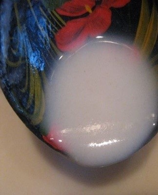 The white powder is dissolved in a little cold water.