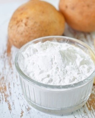 Organza will be white after being in a solution of warm water and potato starch