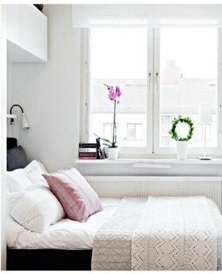 It is better to place a narrow bed along one of the walls.