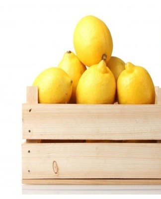 Wrap each lemon in parchment paper and put them in boxes.