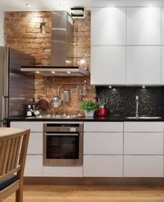 Acrylic cabinet doors without handles and plastic reflect light and are easy to clean.