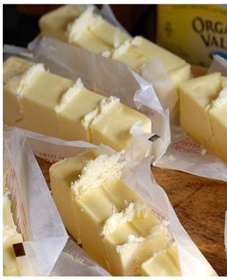 A piece is pre-cut into portions weighing 150-200 g, and each piece is wrapped in parchment.