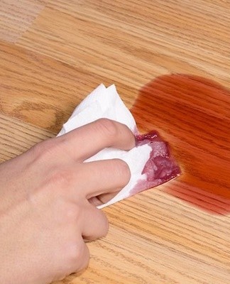 Alcohol stains are best removed with a soft cloth dampened in a mild detergent solution.