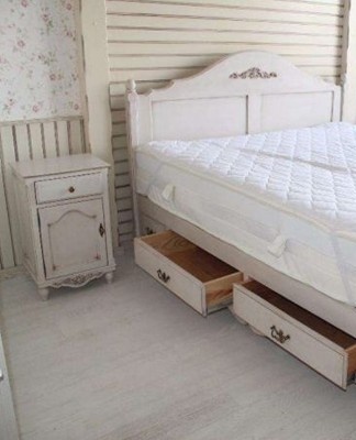 The bed is the main conceptual center of the bedroom.