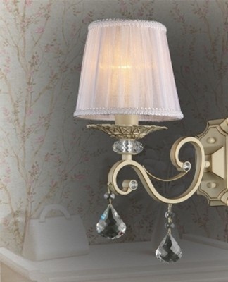 Many sconces in different parts of the bedroom are mounted on bizarre heavy metal brackets.