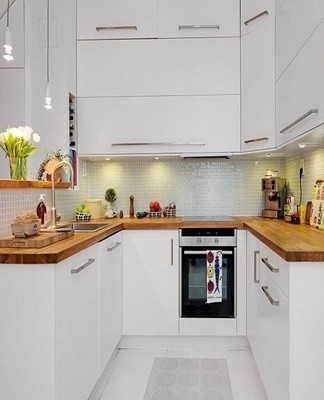 Appliances can be built into furniture or hidden behind the facade.