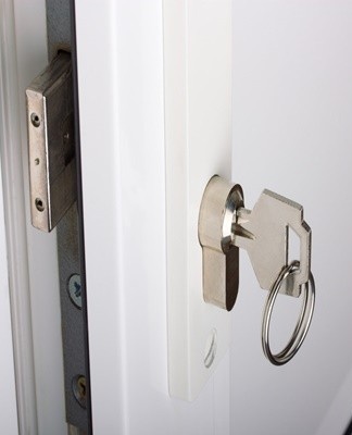 Plastic doors, due to design features, are often locked simultaneously in the swing and tilt positions.