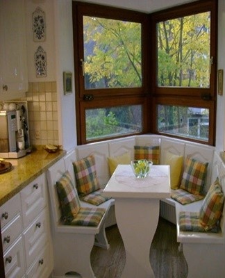 If the kitchen has a bay window, you can use it outside the cubicle and arrange a seating area there.