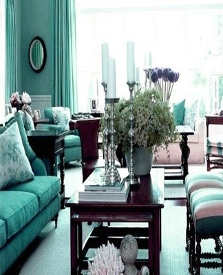 The delicate turquoise palette visually expands the space