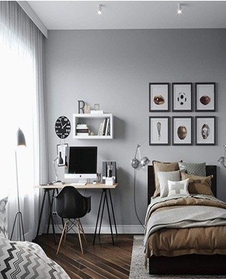 The walls and the ceiling of the bedroom are painted in light gray tones