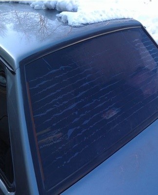 Removing tint from the rear window is much more difficult than from the side