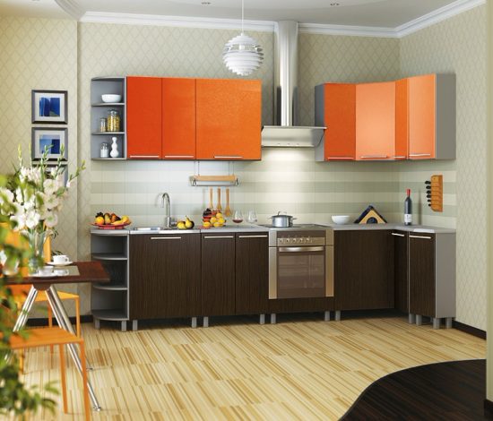 The gray-orange kitchen looks modern.