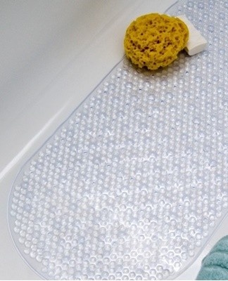 To prevent slipping on the tiles, suction cups are often attached to the interior to hold the mat securely.