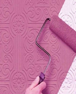 The paint is applied to the walls using a variety of tools.