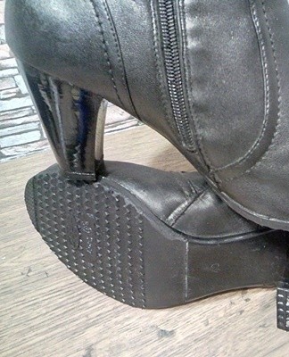 Scratches on the plastic are hidden with paint or nail polish.