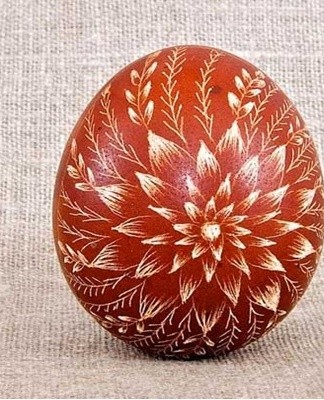 Scrape over the dried shell, holding the egg in the left hand, the tool in the right.