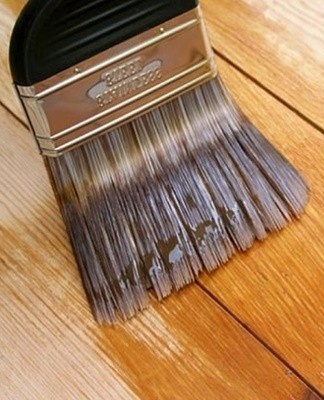 If the door is free of noticeable flaws, use stain or stain varnish to renovate it after sanding and priming.