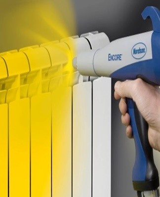 Using a gun, an electric shock is applied to the powder particles and these are attracted to the aluminum surface.