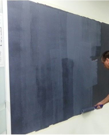 Apply chalkboard paint to the wall